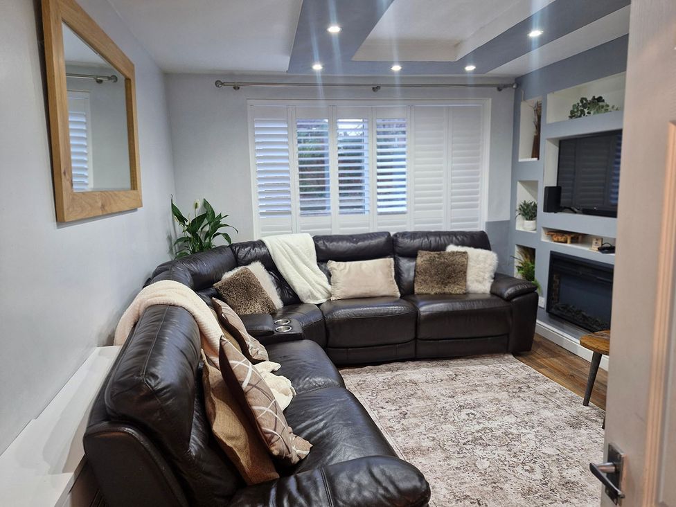 A living room with a sofa and television at 3 Bedroom, sleeping 5 with Wifi, Wythenshawe near Manchester