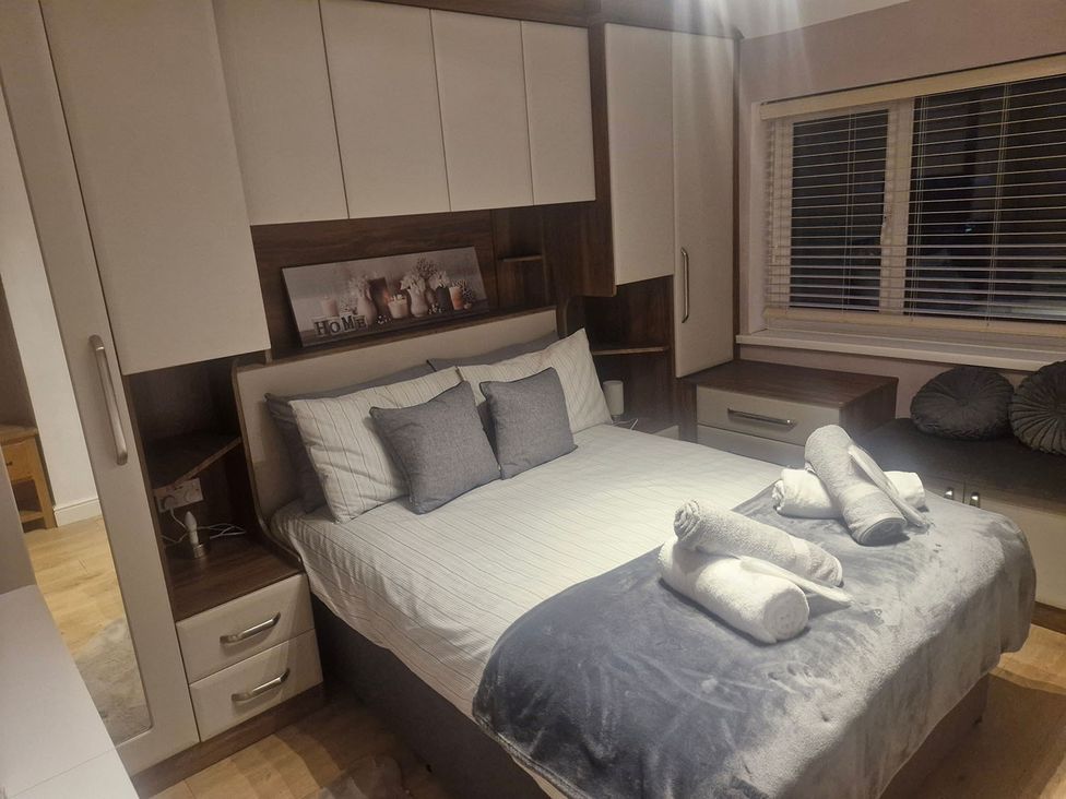 A bedroom with a bed and furniture at 3 Bedroom, sleeping 5 with Wifi in Wythenshawe near Manchester