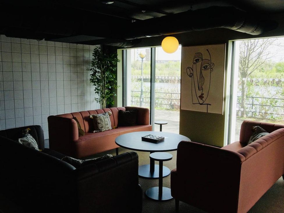 A living room with sofas and a coffee table at Apartment near Old Trafford, Sleeping 3 with Garden and Parking, Manchester