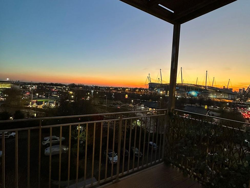 A balcony view overlooking a stadium and cityscape at Apartment, Sleeps 6 with Stadium View, Manchester