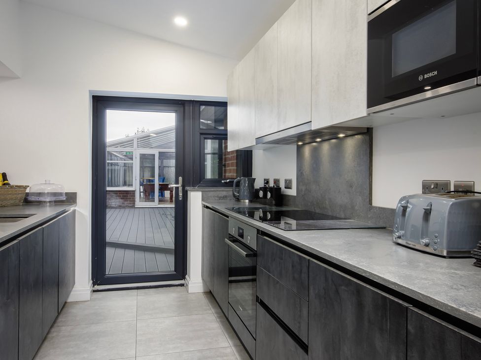A kitchen with modern appliances at Wind Farm