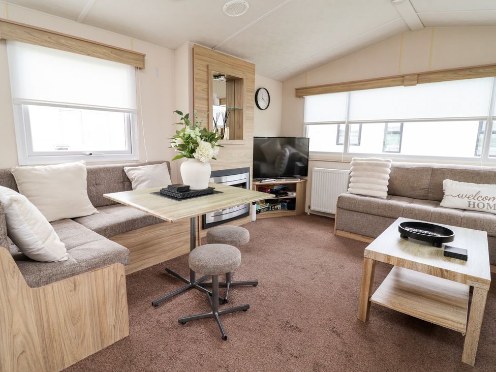 A living room with a sofa and a television at B54