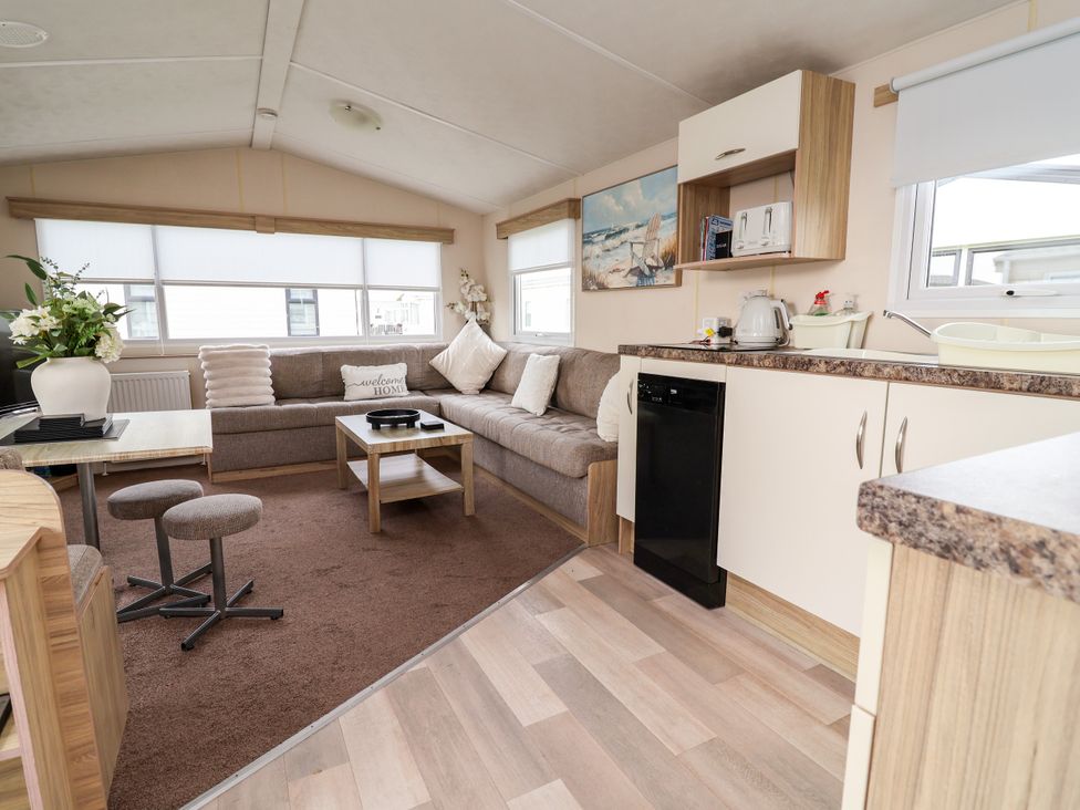 A living room with a sofa and coffee table at B54