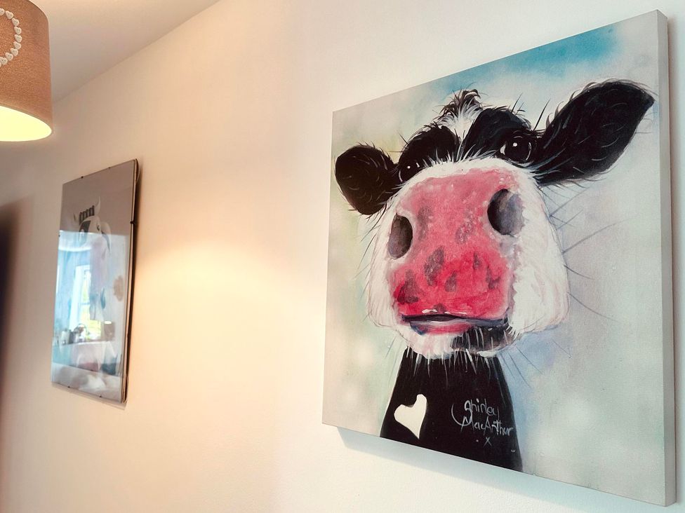 A cow painting and wall art at Muddy Boots – Scarpa, Kirkby Stephen