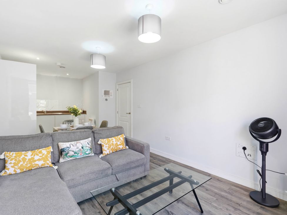 A living room with a sofa and table at Apartment 56 in Birmingham