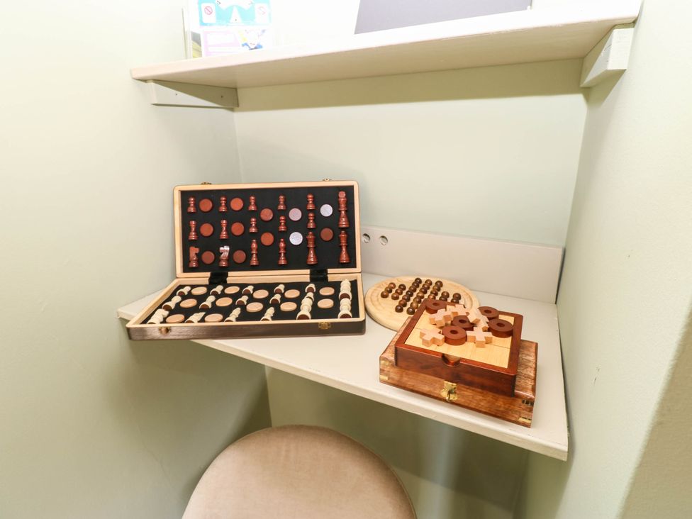 A games corner with chess set and wooden game boxes at Sands Green in Appleby-In-Westmorland