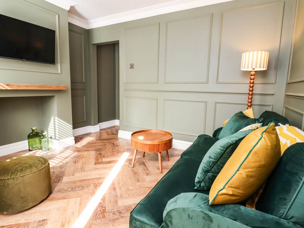 A living room with a sofa and coffee table at 9 North Street in Chester