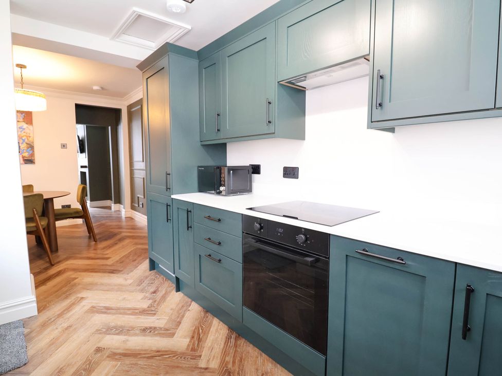 A kitchen with cabinets and appliances at 9 North Street Chester