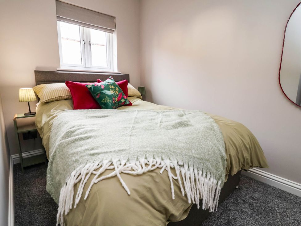 A bedroom with a bed and nightstand at 9 North Street Chester