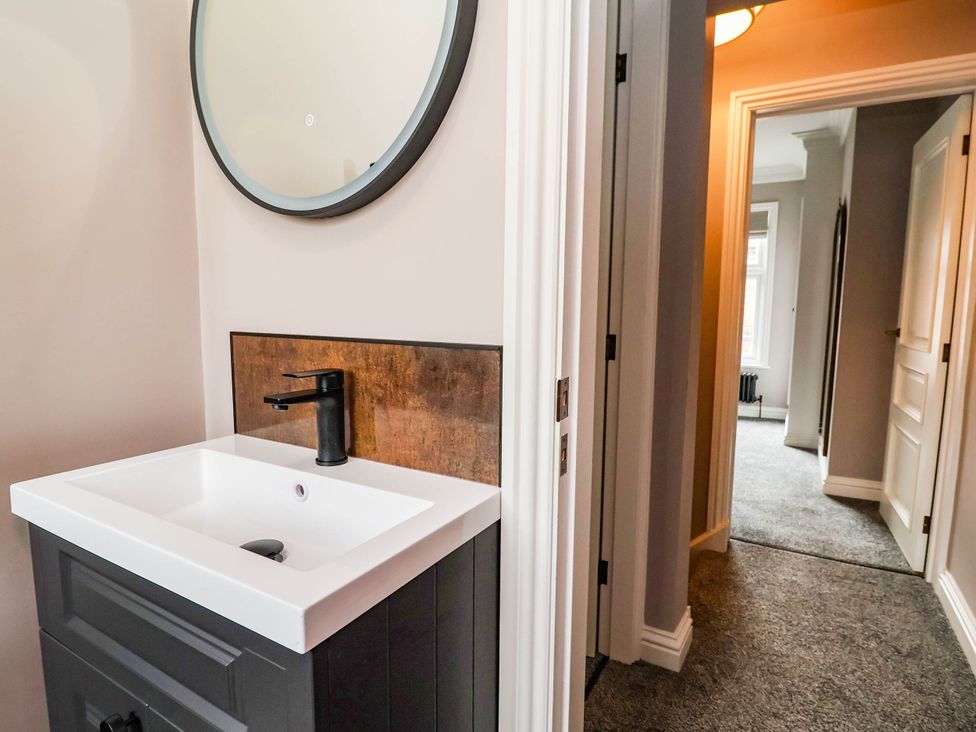A bathroom with a sink and mirror at 9 North Street Chester