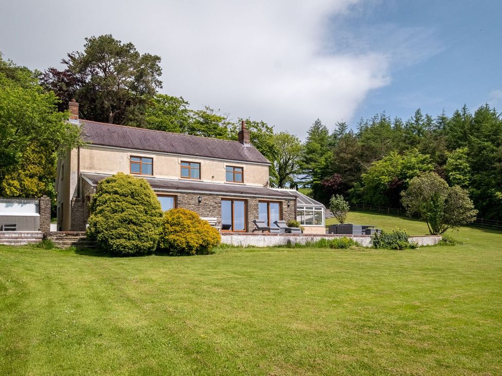 A house with a garden and trees at Blaenachddu Newcastle Emlyn