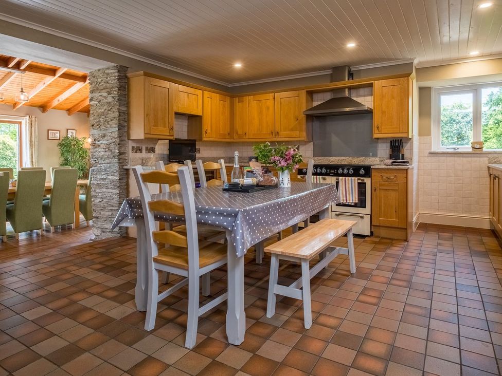 A kitchen with a table and chairs at Blaenachddu in Newcastle Emlyn