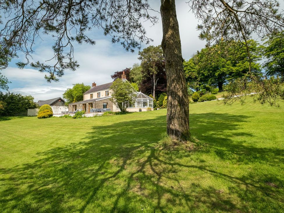 A house with a garden and trees at Blaenachddu Newcastle Emlyn