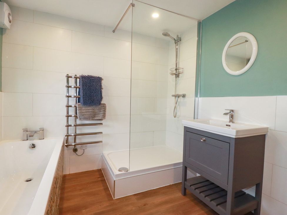A bathroom with a sink and shower at Chy-an-Lowena in Crantock