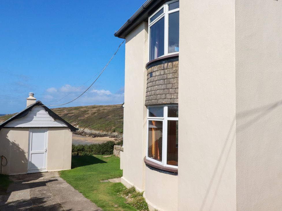 A building exterior with windows and a path at Chy-an-Lowena in Crantock