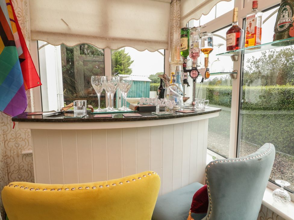 A bar area with bottles and glasses at Bruckless Rest Fine Country Dining B&B in Bruckless