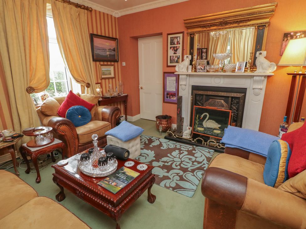 A living room with a sofa and coffee table at Bruckless Rest Fine Country Dining B&B Bruckless