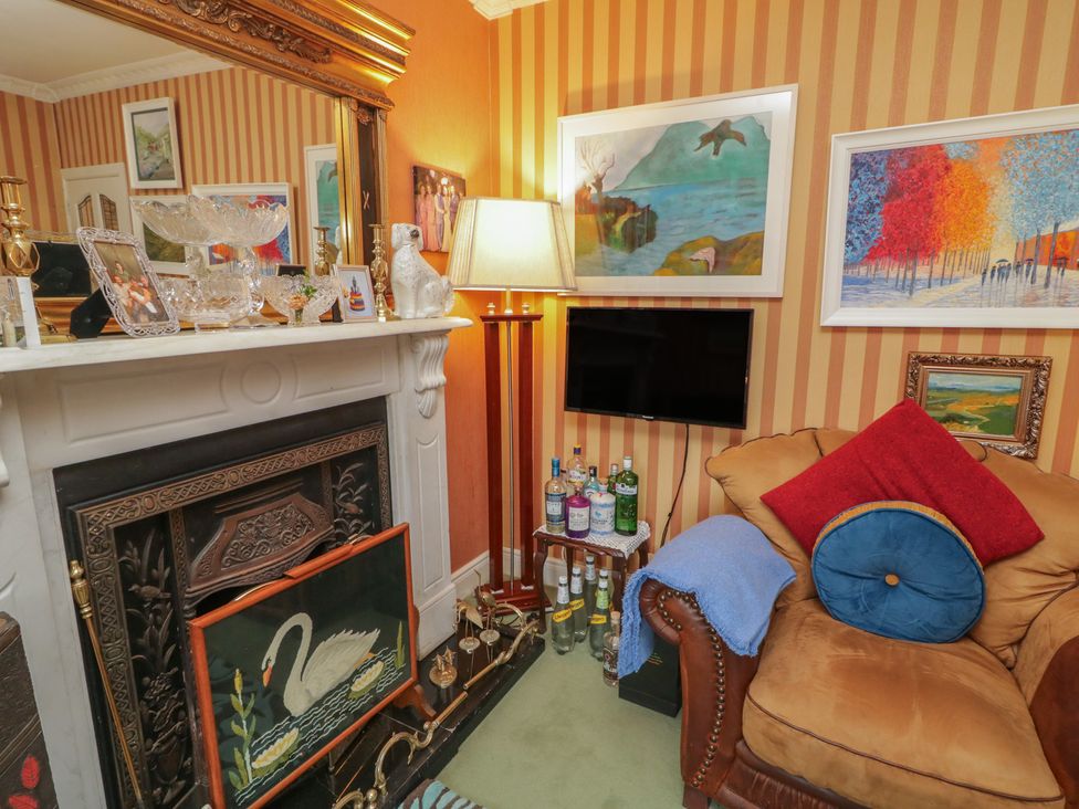 A living room with a fireplace and a sofa at Bruckless Rest Fine Country Dining B&B Bruckless