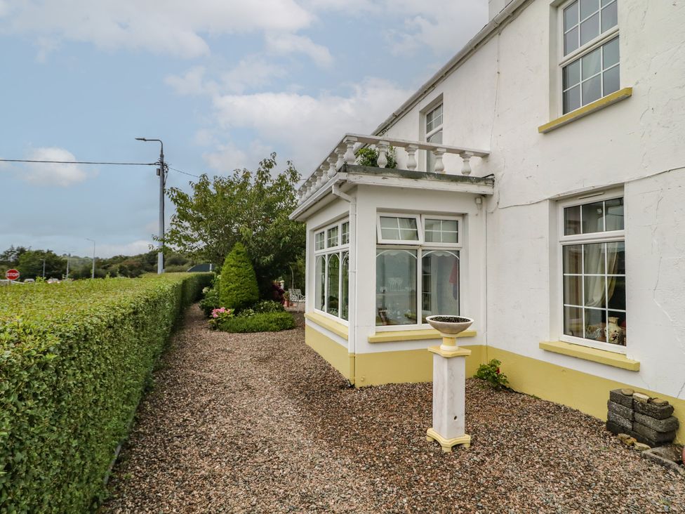 A house with a garden and pathway at Bruckless Rest Fine Country Dining B&B Bruckless