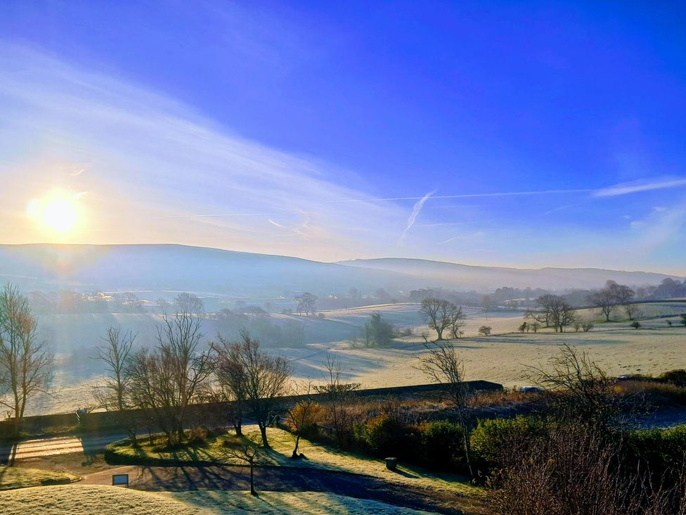 A landscape with hills and trees at Castleys Mount in Skipton