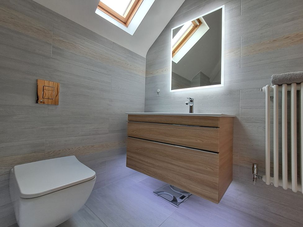 A bathroom with a sink and a toilet at Castleys Mount, Skipton