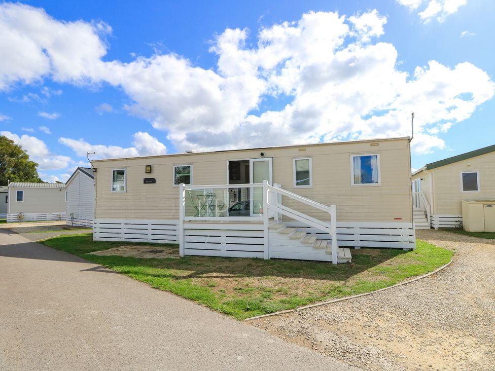 A mobile home with steps and porch at Beach Retreat in 