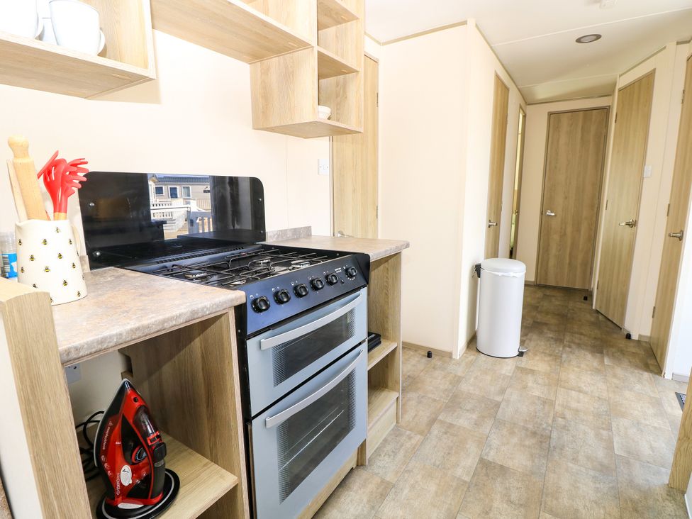 A kitchen with a stove and oven at Beach Retreat in 