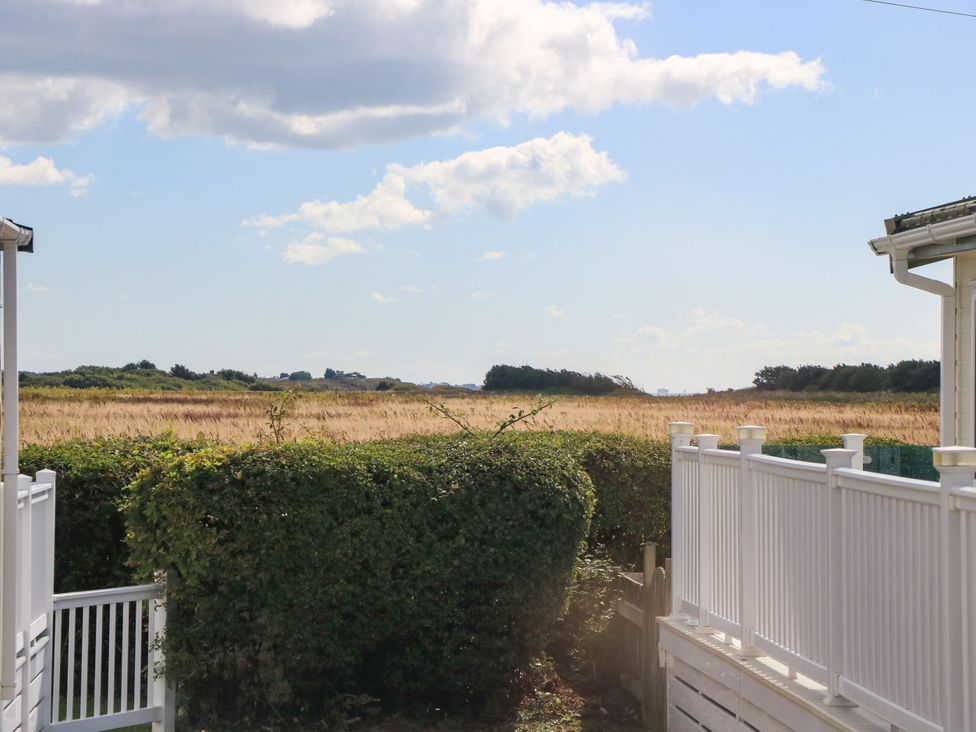 A view of a field and sky at Beach Retreat in 