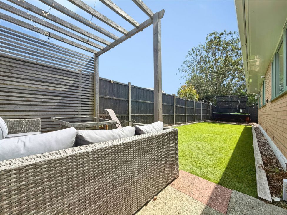 A garden with a seating area and grass at Gralyn Place 