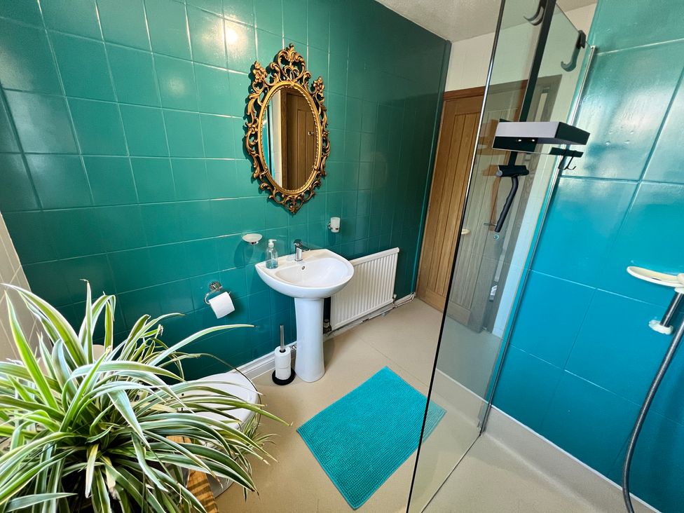 A bathroom with a sink and shower at Ty Marlyn St Davids