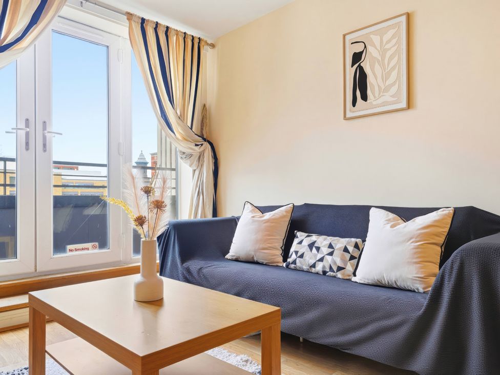 A living room with a sofa and coffee table at Apartment 28 in Birmingham