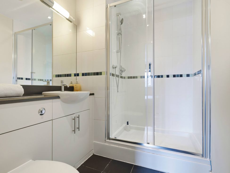 A bathroom with a shower and sink at Apartment 28 in Birmingham