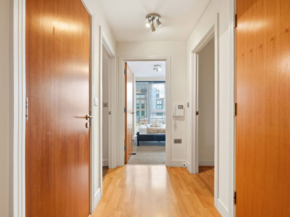 A hallway with doors and flooring at Apartment 28 in Birmingham