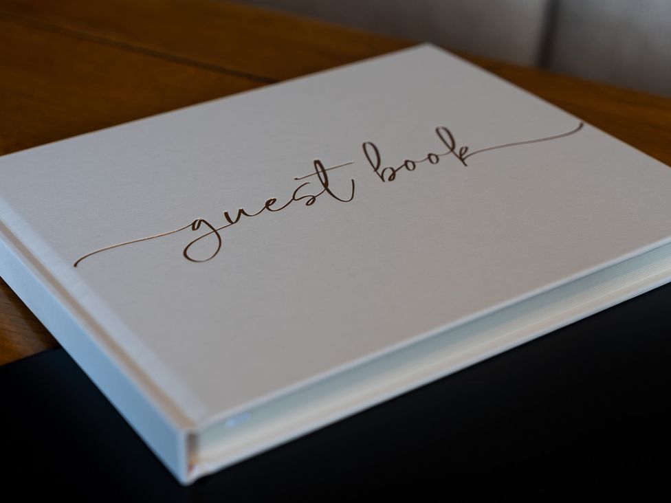 A guest book placed on a table at The Old Print House in Stanley Common