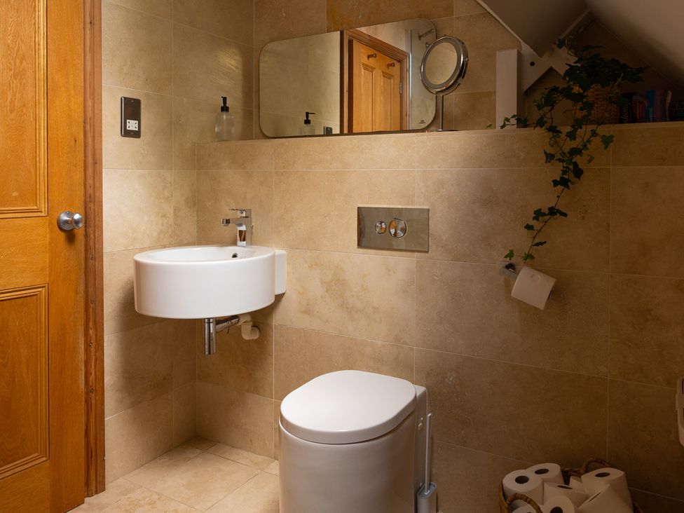 A bathroom with a sink and toilet at The Old Print House in Stanley Common