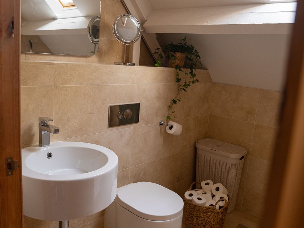 A bathroom with a sink and toilet at The Old Print House in Stanley Common