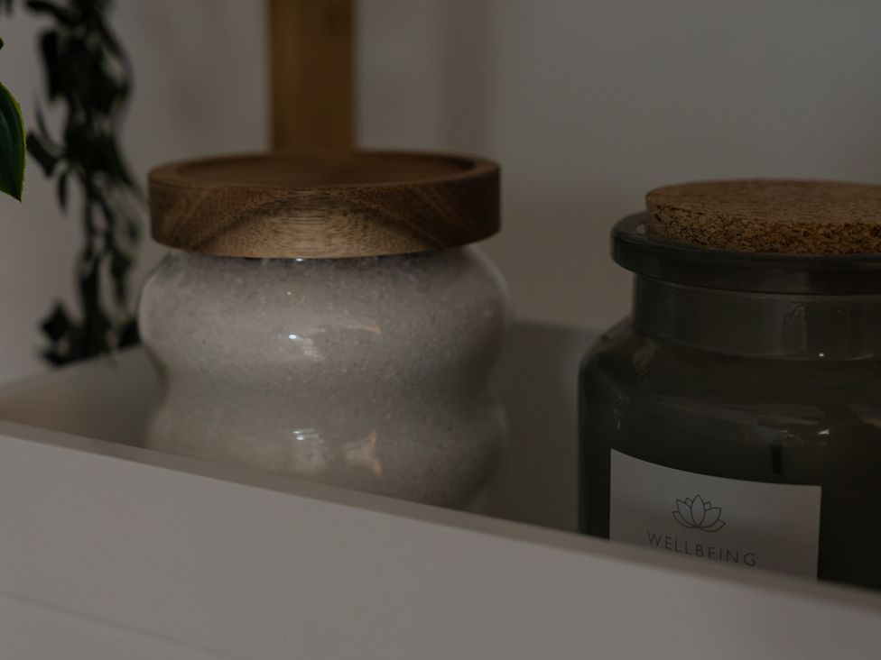 Jars with lids on a shelf at The Old Print House in Stanley Common