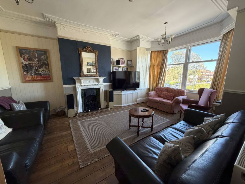 A living room with sofas and a television at Ryburn Lodge in Bridlington