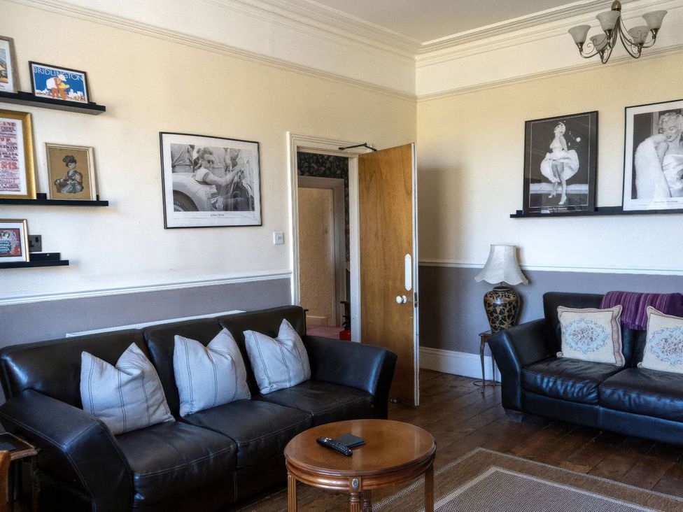 A living room with a sofa and coffee table at Ryburn Lodge Bridlington