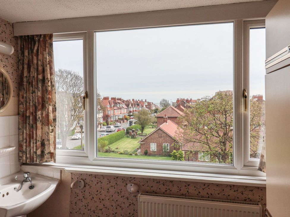 A bathroom with a sink and window at Ryburn Lodge in Bridlington
