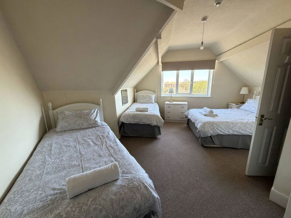 A bedroom with beds and furniture at Ryburn Lodge in Bridlington