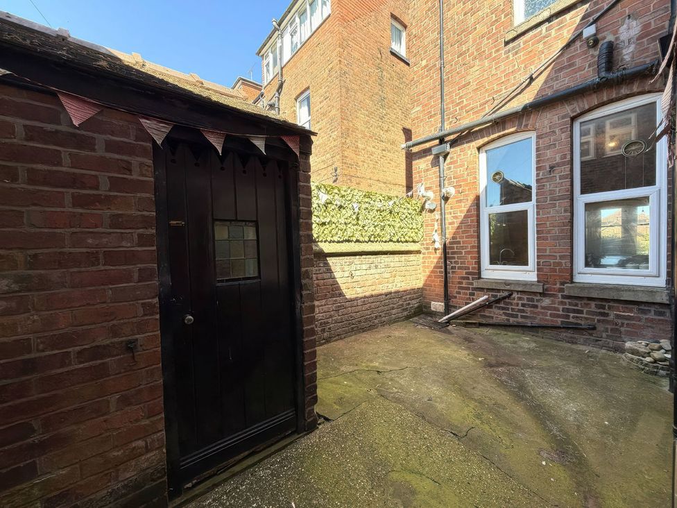 An outdoor area with a shed and windows at Ryburn Lodge in Bridlington