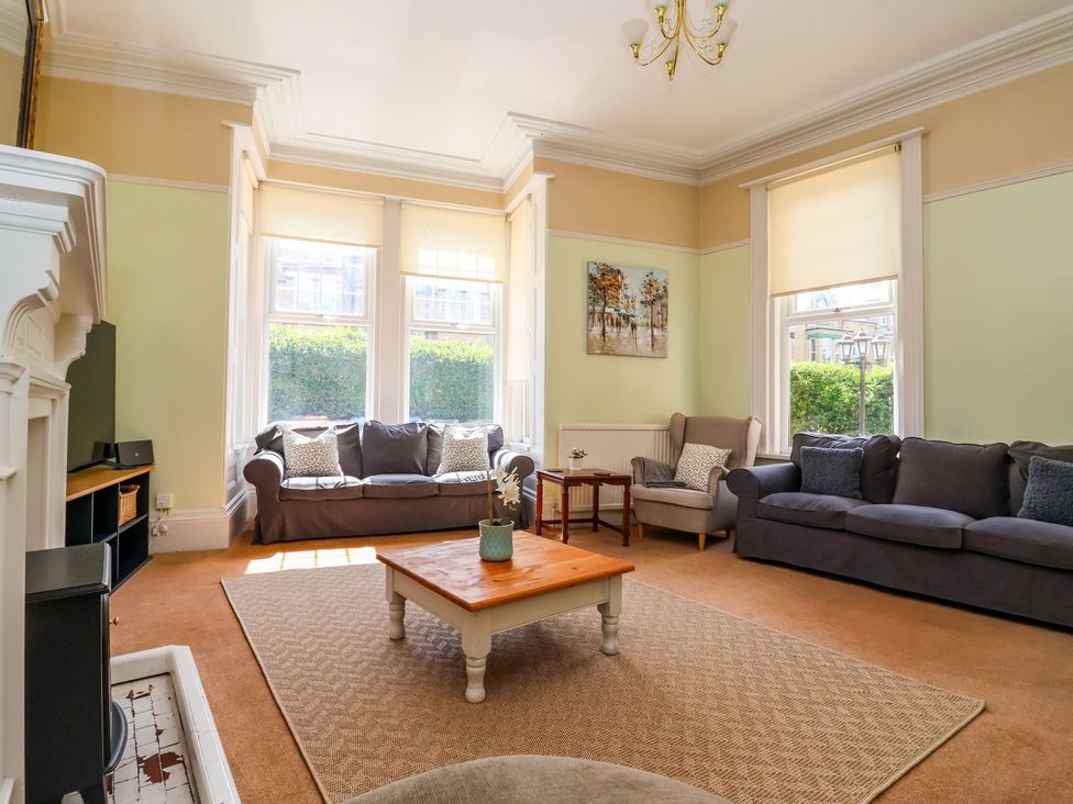 A living room with sofas and a coffee table at Trinity Lodge in Bridlington