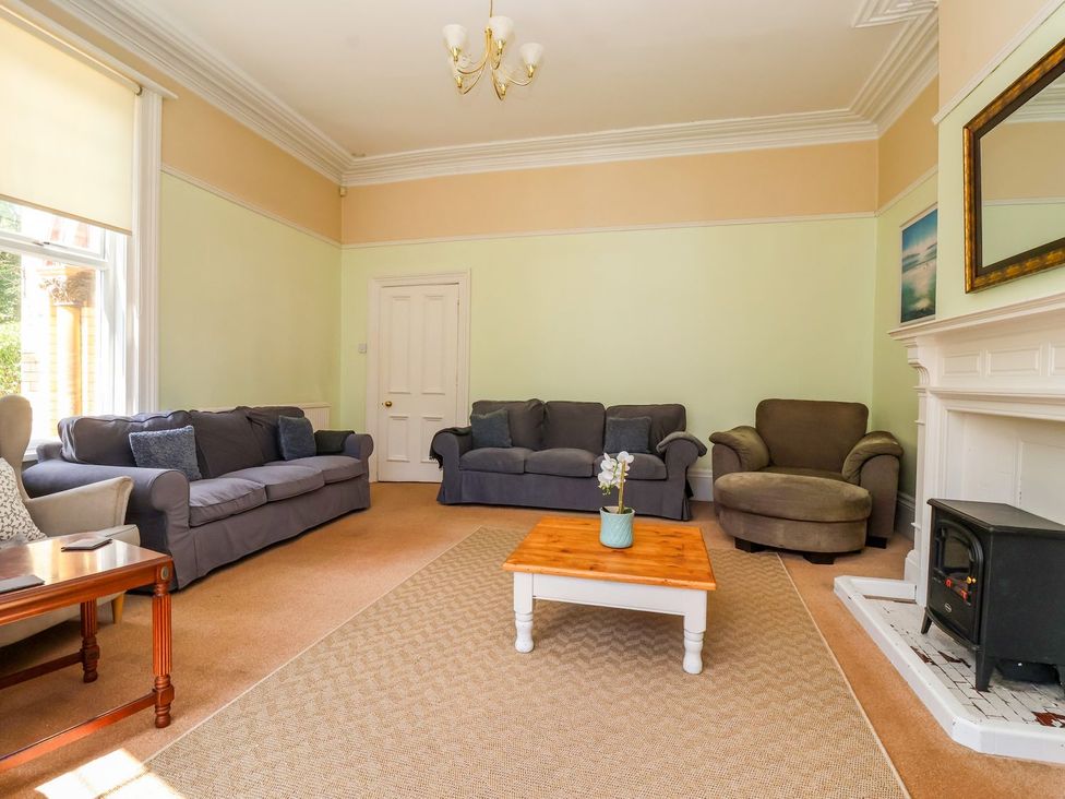 A living room with a sofa and coffee table at Trinity Lodge in Bridlington