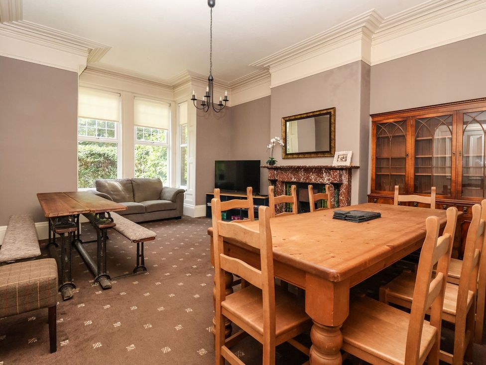 A dining room with a table and chairs at Trinity Lodge in Bridlington