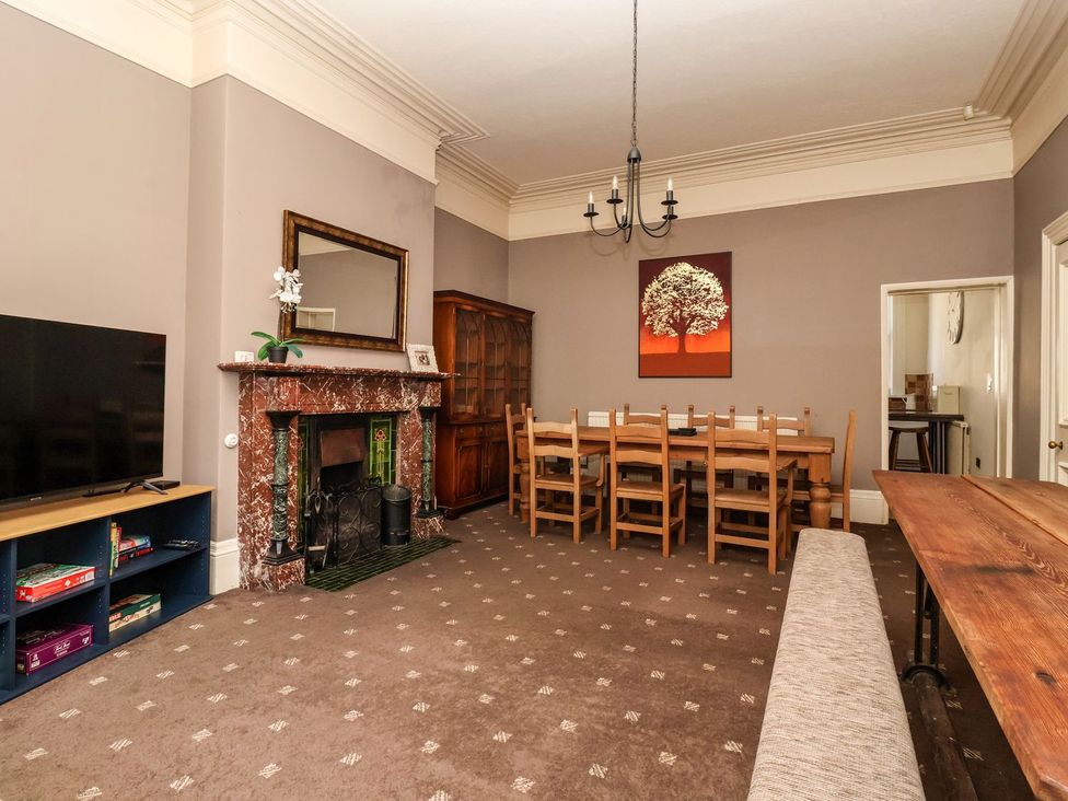 A dining room with a table and chairs at Trinity Lodge in Bridlington