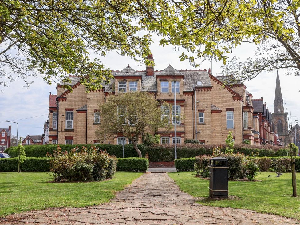 A building with trees and a pathway at Trinity Lodge in Bridlington