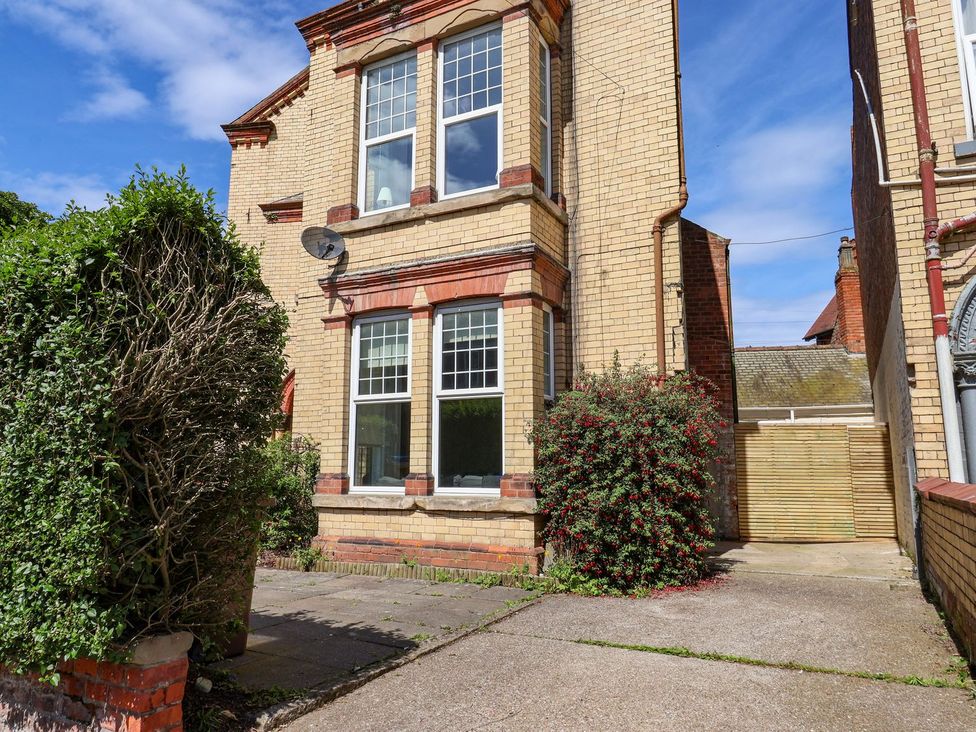 An outdoor area with a building and driveway at Trinity Lodge in Bridlington