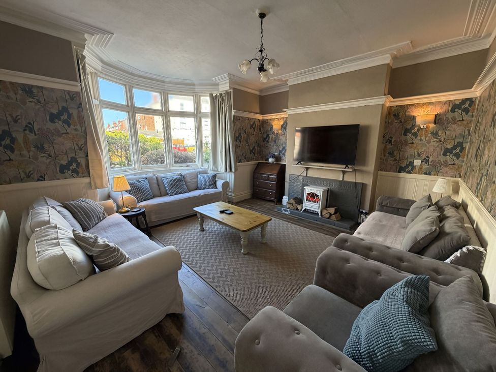 A living room with sofas and a television at Avalon Lodge in Bridlington