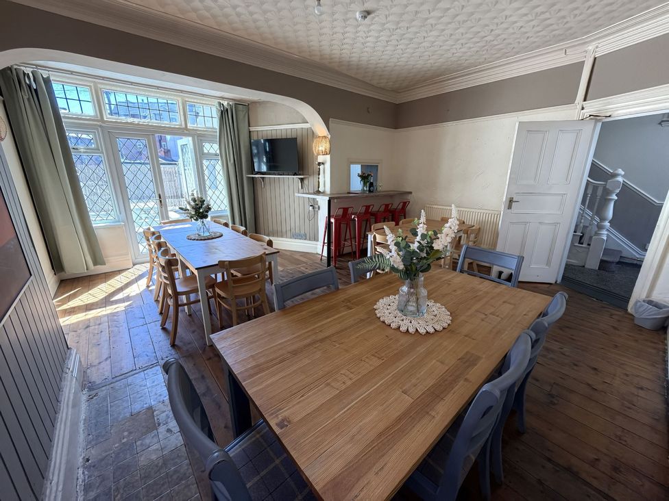 A dining room with a large table and chairs at Avalon Lodge in Bridlington
